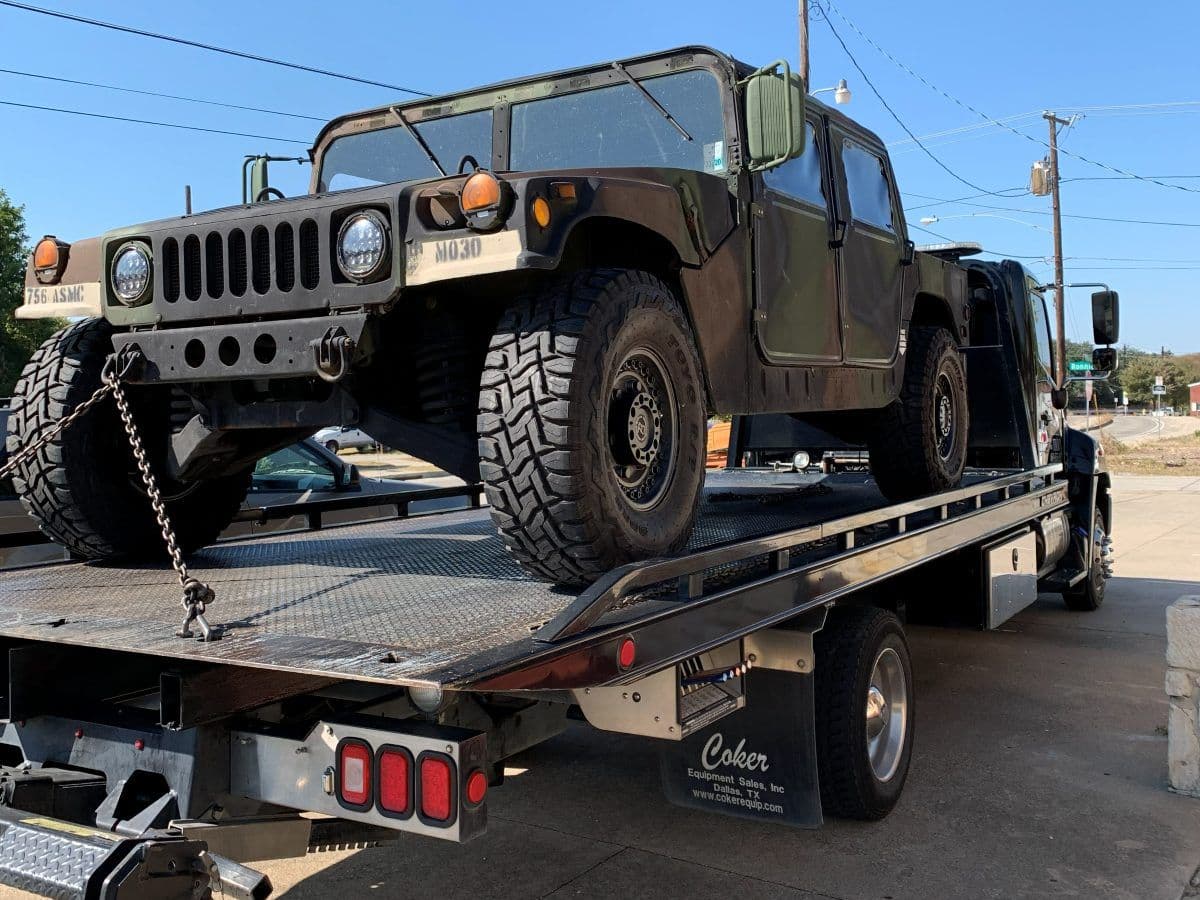Military Humvee secured on a Maverick Towing flatbed